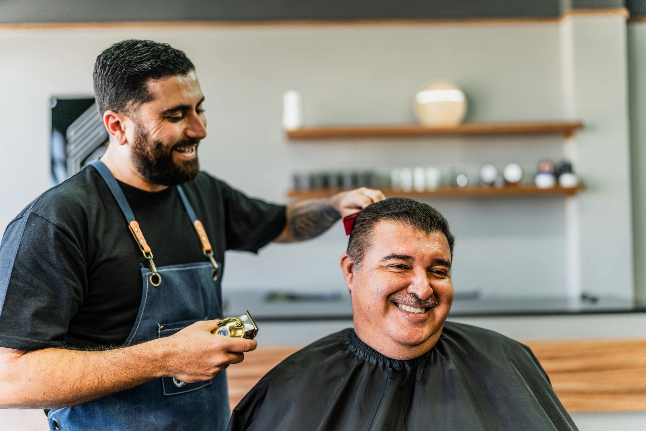 Barber consulting with a client during a haircut